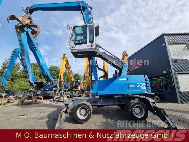Fuchs MHL 335 / ZSA /AC/ Hochfahr.Kabine/Magnetanlage Excavatoare cu roti